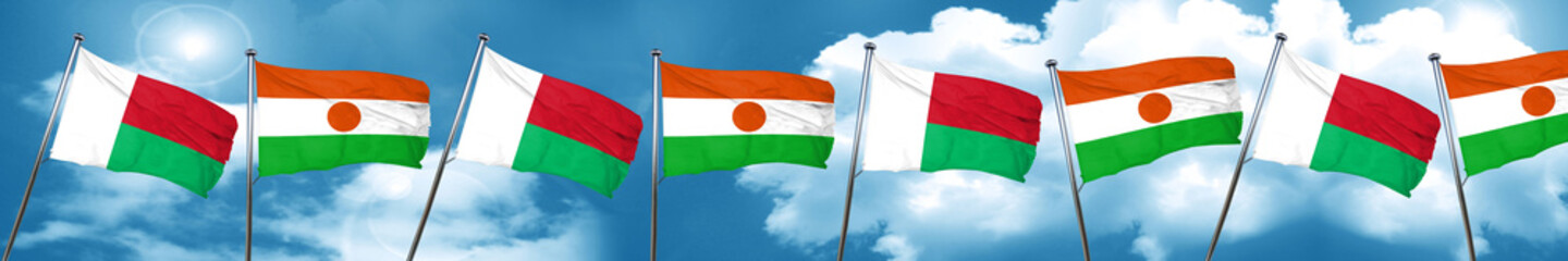 Madagascar flag with Niger flag, 3D rendering