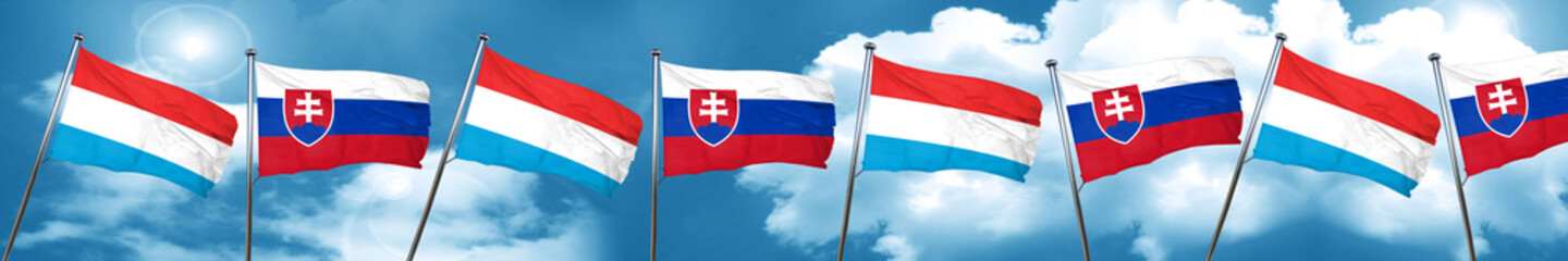 Luxembourg flag with Slovakia flag, 3D rendering