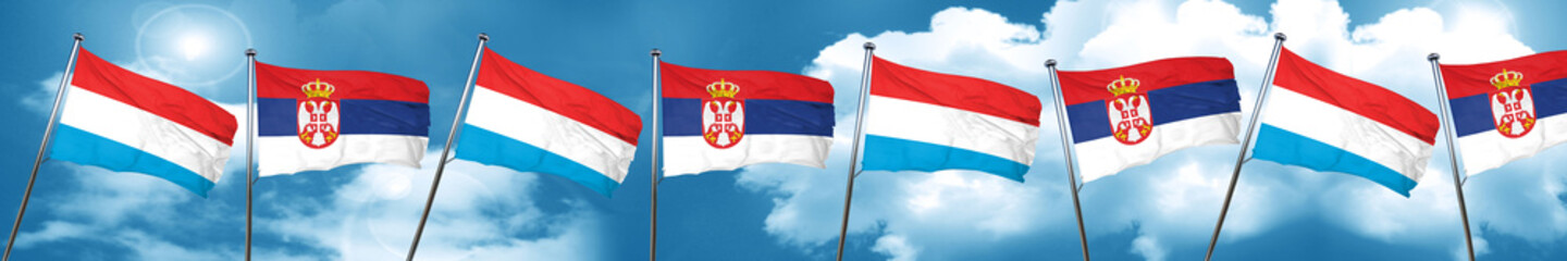 Luxembourg flag with Serbia flag, 3D rendering