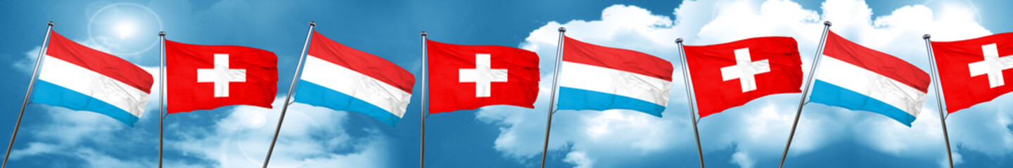 Luxembourg flag with Switzerland flag, 3D rendering