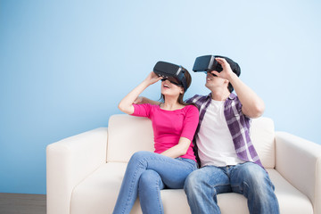 young couple watch vr game