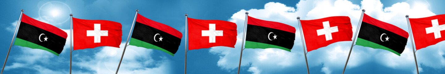 Libya flag with Switzerland flag, 3D rendering