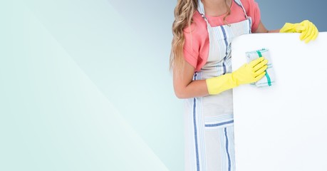 Mid section of woman cleaning wall