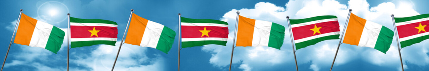 Ivory coast flag with Suriname flag, 3D rendering