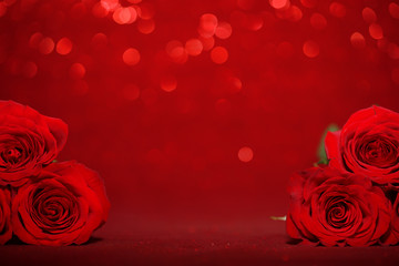 Beautiful red roses on sparkling red background © Leigh Prather