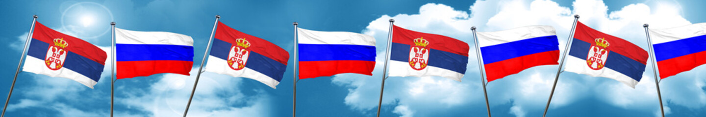 Naklejka na ściany i meble Serbia flag with Russia flag, 3D rendering