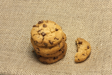 Chocolate chips cookies on burlap and teal blue textures