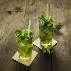 Mojito cocktails with mint leaves and lime