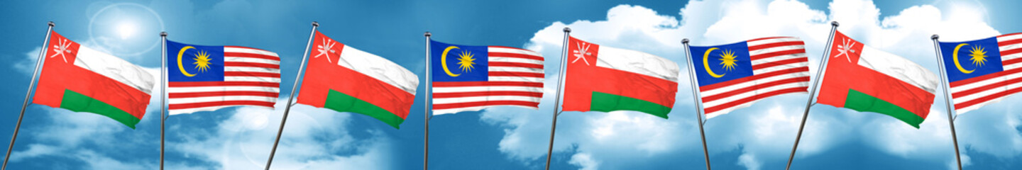 Oman flag with Malaysia flag, 3D rendering