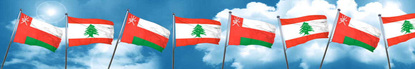 Oman flag with Lebanon flag, 3D rendering