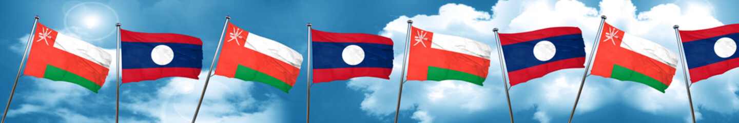 Fototapeta na wymiar Oman flag with Laos flag, 3D rendering