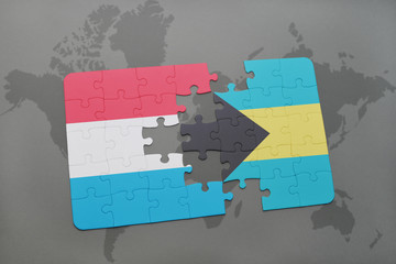 puzzle with the national flag of luxembourg and bahamas on a world map
