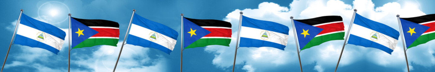 nicaragua flag with South Sudan flag, 3D rendering