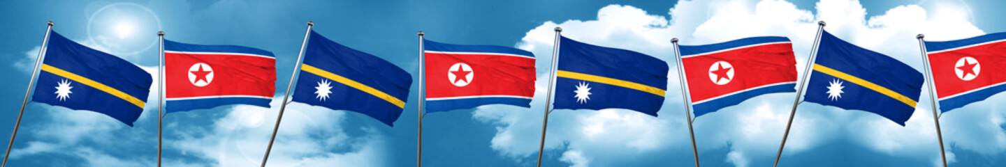 Nauru flag with North Korea flag, 3D rendering