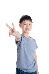 Young asian boy smiling over white background