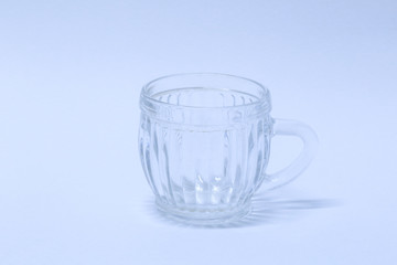 Empty glass tea cup. Isolated on white background