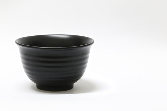 Empty black bowl isolated on white background