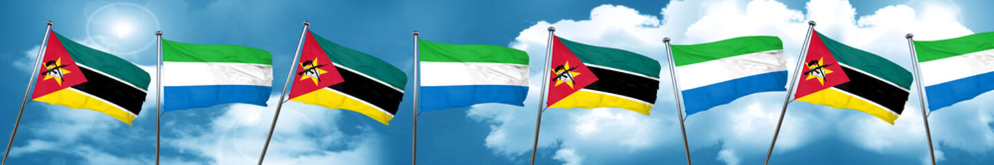Mozambique flag with Sierra Leone flag, 3D rendering