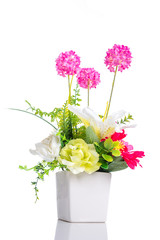 Fototapeta premium Artificial flower in flower pot isolated over white