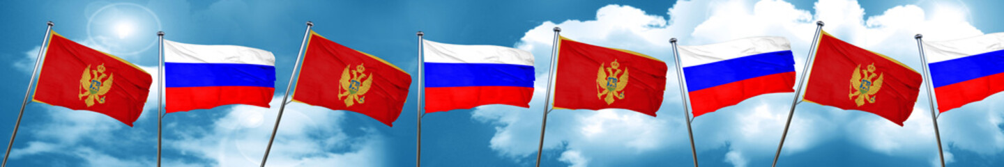 Naklejka na ściany i meble Montenegro flag with Russia flag, 3D rendering