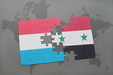 puzzle with the national flag of luxembourg and syria on a world map