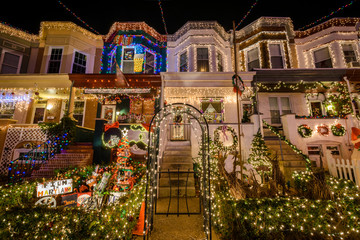 Fototapeta na wymiar Holiday/ Christmas Lights on Building in Hampden, Baltimore Mary