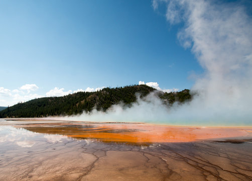 Grand Prismatic Spring during the day in the Midway Geyser Basin in Yellowstone National Park in Wyoming USA
