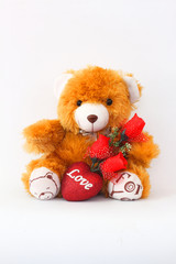 Brown teddy bears and red roses on a white background.