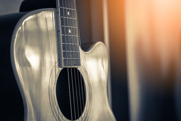 Fototapeta premium closed up guitar in soft light from window