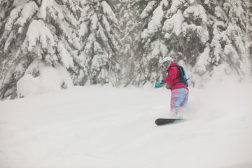 Fototapeta na wymiar Snowboarder freeride jump in powder.