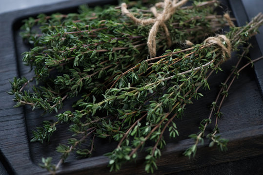 Close-up of two bunches of fresh thyme, selective focus