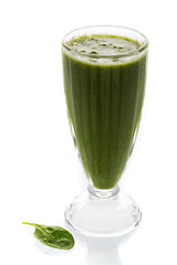 Raw green smoothie with fruits and spinach isolated