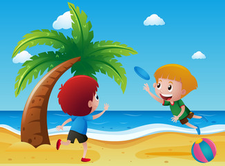 Obraz na płótnie Canvas Two boys playing frisbee on the beach