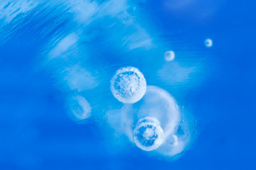 Blue ice with bubbles, background