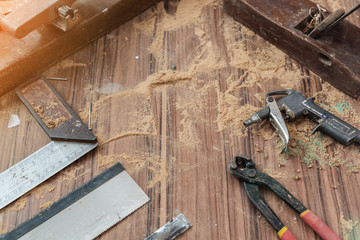 wood workshop with handcraft tools and raw wood on construction