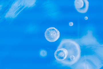 Obraz na płótnie Canvas Blue ice with bubbles, background
