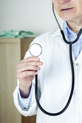 Doctor holding stethoscope