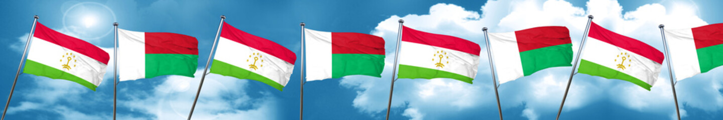 Tajikistan flag with Madagascar flag, 3D rendering