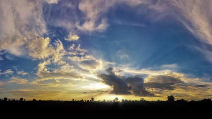 Fototapeta premium sunshine on sunset with Silhouette, sky and cloud