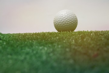 Golf ball is on green grass