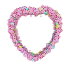 Frame in a form of a heart made of small colorful hearts on white background
