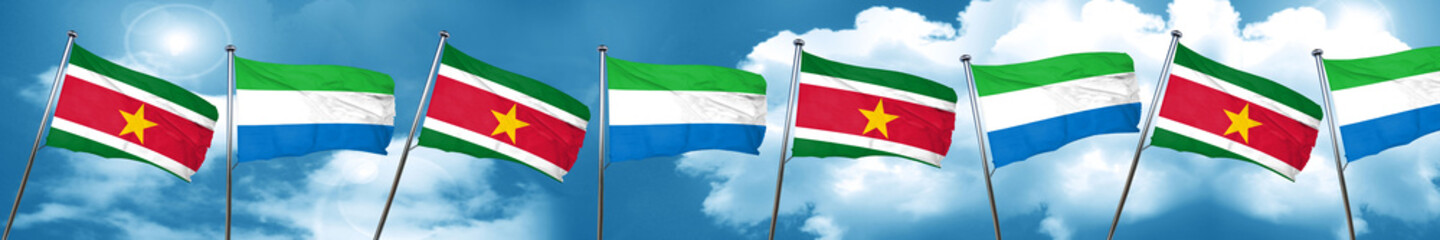 Suriname flag with Sierra Leone flag, 3D rendering