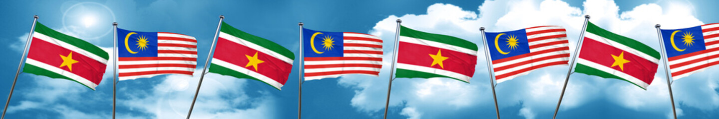 Fototapeta na wymiar Suriname flag with Malaysia flag, 3D rendering