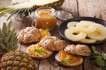 Sweet sandwiches with pineapple jam and butter close-up. horizontal