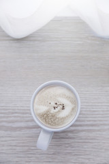 morning white cup coffee with white curtain near window with sun