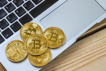 Photo Golden Bitcoins On laptop. Trading Concept Of Crypto Currency