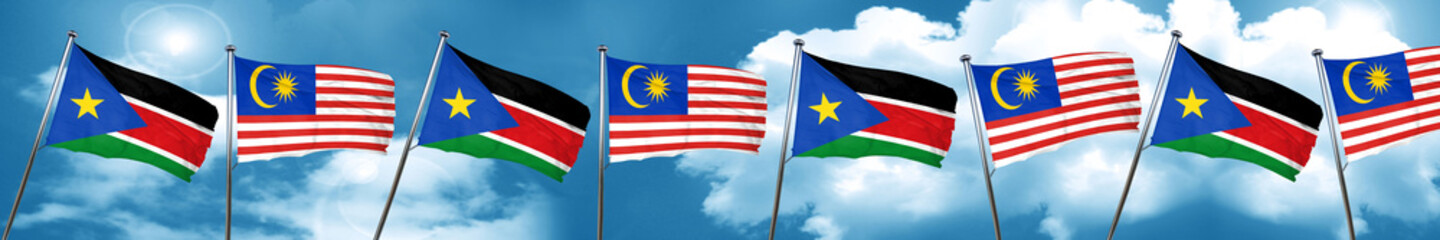 south sudan flag with Malaysia flag, 3D rendering