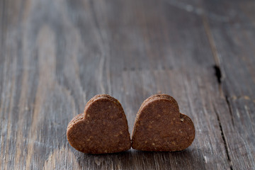 Valentine's chocolate heart cookies on black wooden old background