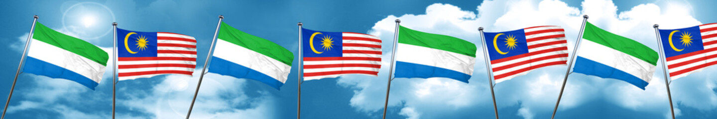 Sierra Leone flag with Malaysia flag, 3D rendering