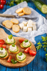 Healthy mini sandwiches with cucumber and feta cheese